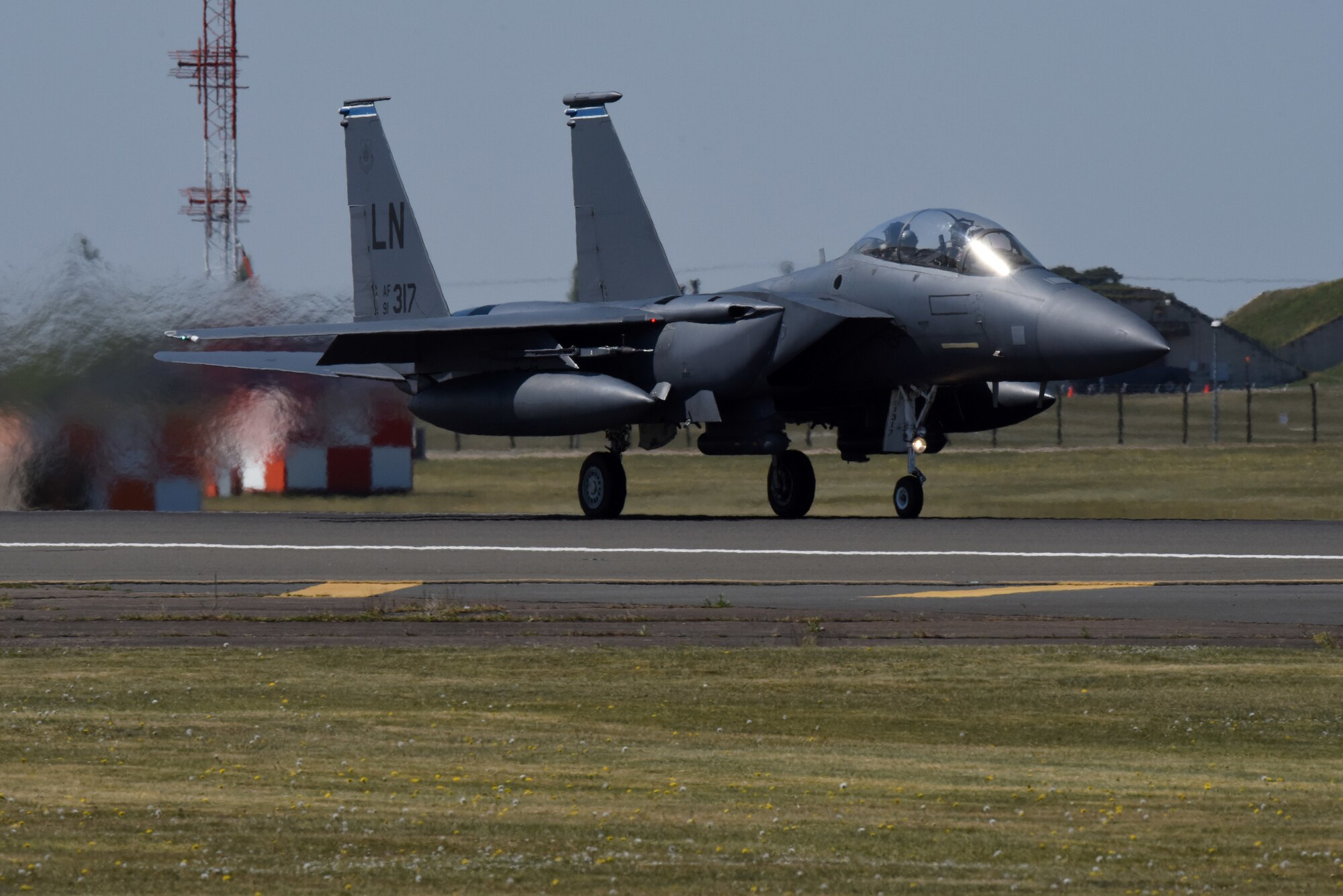 An F-15E Strike Eagle assigned to the 492nd Fighter Squadron takes off at Royal Air Force Lakenheath, England, April 21, 2020. Despite the current COVID-19 crisis, the 48th Fighter Wing continues to maintain mission-readiness in order to safeguard U.S. national interests and those of our allies and partners. (U.S. Air Force photo by Airman 1st Class Rhonda Smith)