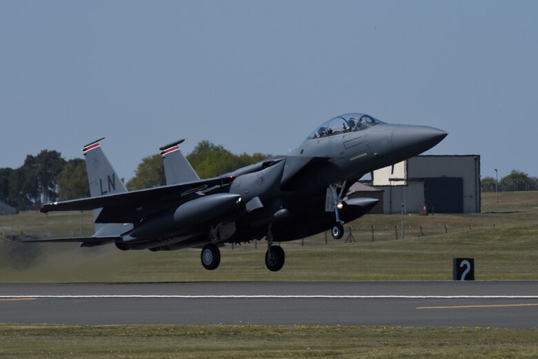 An F-15E Strike Eagle assigned to the 494th Fighter Squadron takes off at Royal Air Force Lakenheath, England, April 21, 2020. Despite the current COVID-19 crisis, the 48th Fighter Wing continues to maintain mission-readiness in order to safeguard U.S. national interests and those of our allies and partners. (U.S. Air Force photo by Airman 1st Class Rhonda Smith)