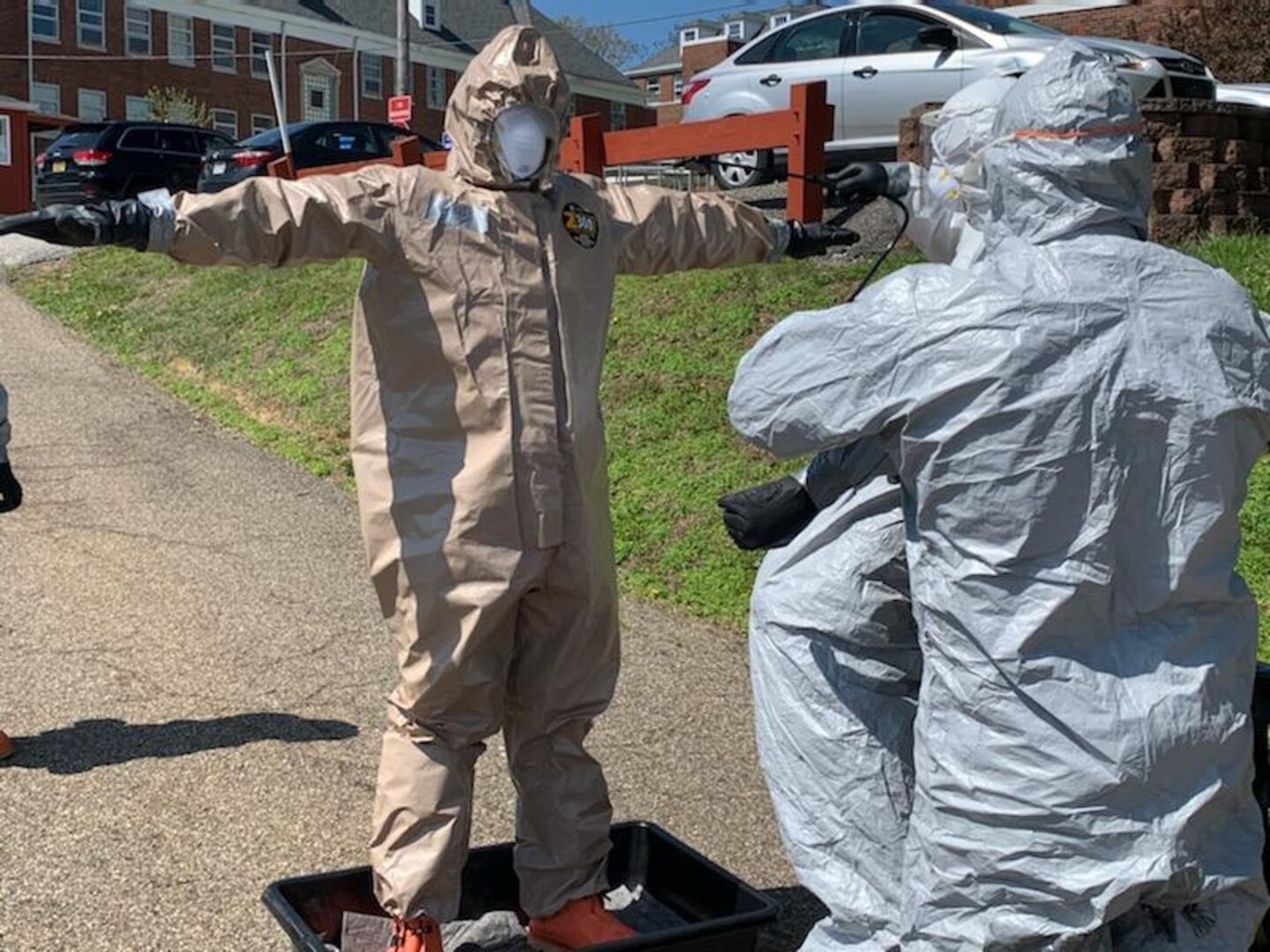 A member of the West Virginia National Guard Task Force CRE undergoes decontamination following COVID-19 testing at a veterans home facility April 20, 2020. The West Virginia National Guard conducted COVID-19 testing at two veterans home facilities in Barboursville and Clarksburg totaling 411 patients and staff following an executive order issued by Governor Jim Justice to test all nursing home facilities in the state. (West Virginia National Guard photo)