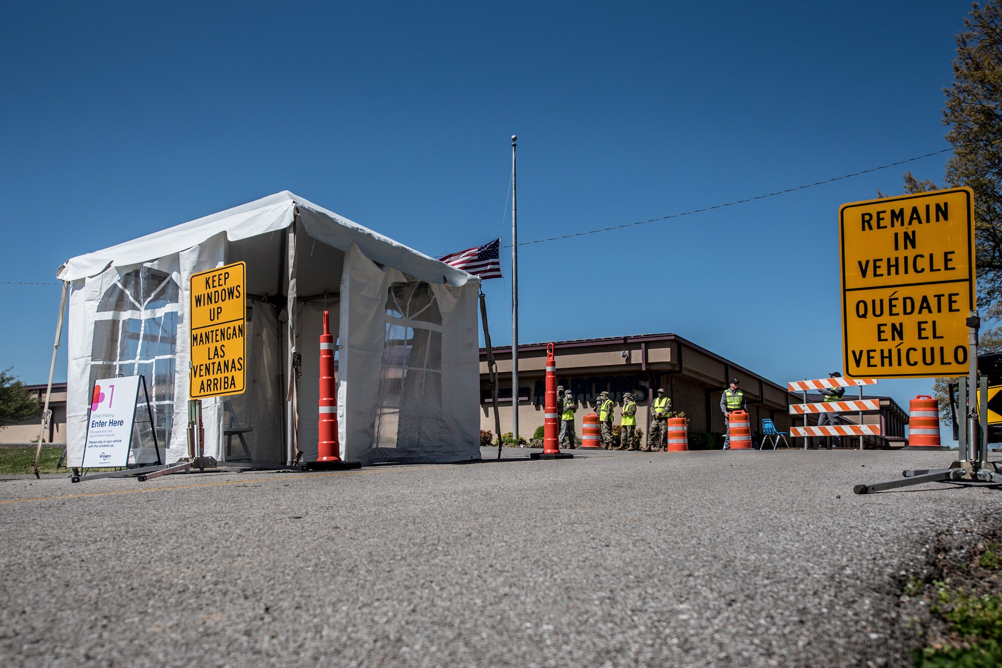 Airmen from the Kentucky Air National Guard’s 123rd Airlift Wing direct patients through a drive-through testing station for COVID-19 in Madisonville, Ky., on April 21, 2020. Kentucky Air Guardsmen will be supporting multiple testing stations across the state. (U.S. Air National Guard photo by Staff Sgt. Joshua Horton)