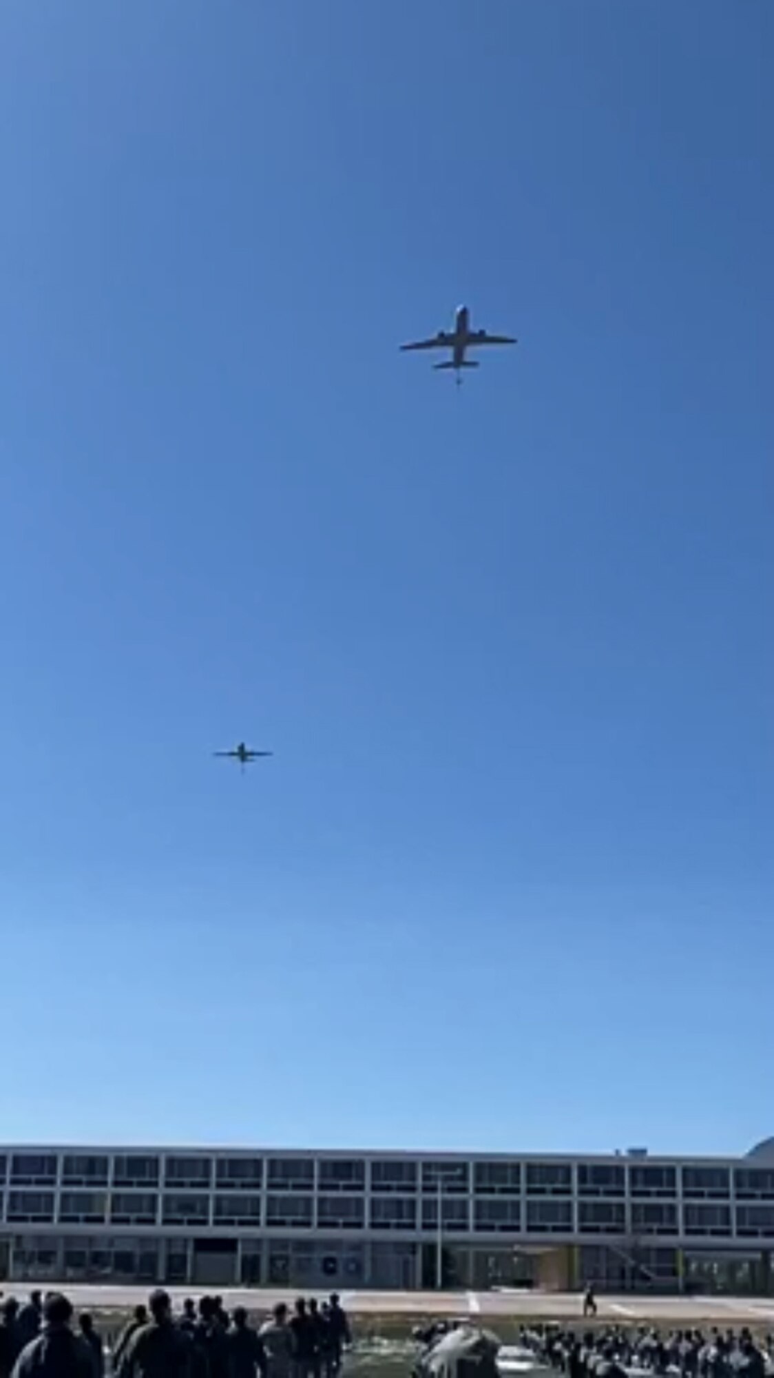 Two KC-46 Pegasus aircraft assigned to the 56th Air Refueling Squadron at Altus Air Force Base, Oklahoma, fly over the United States Air Force Academy in Colorado Springs, Colorado, April 17, 2020.