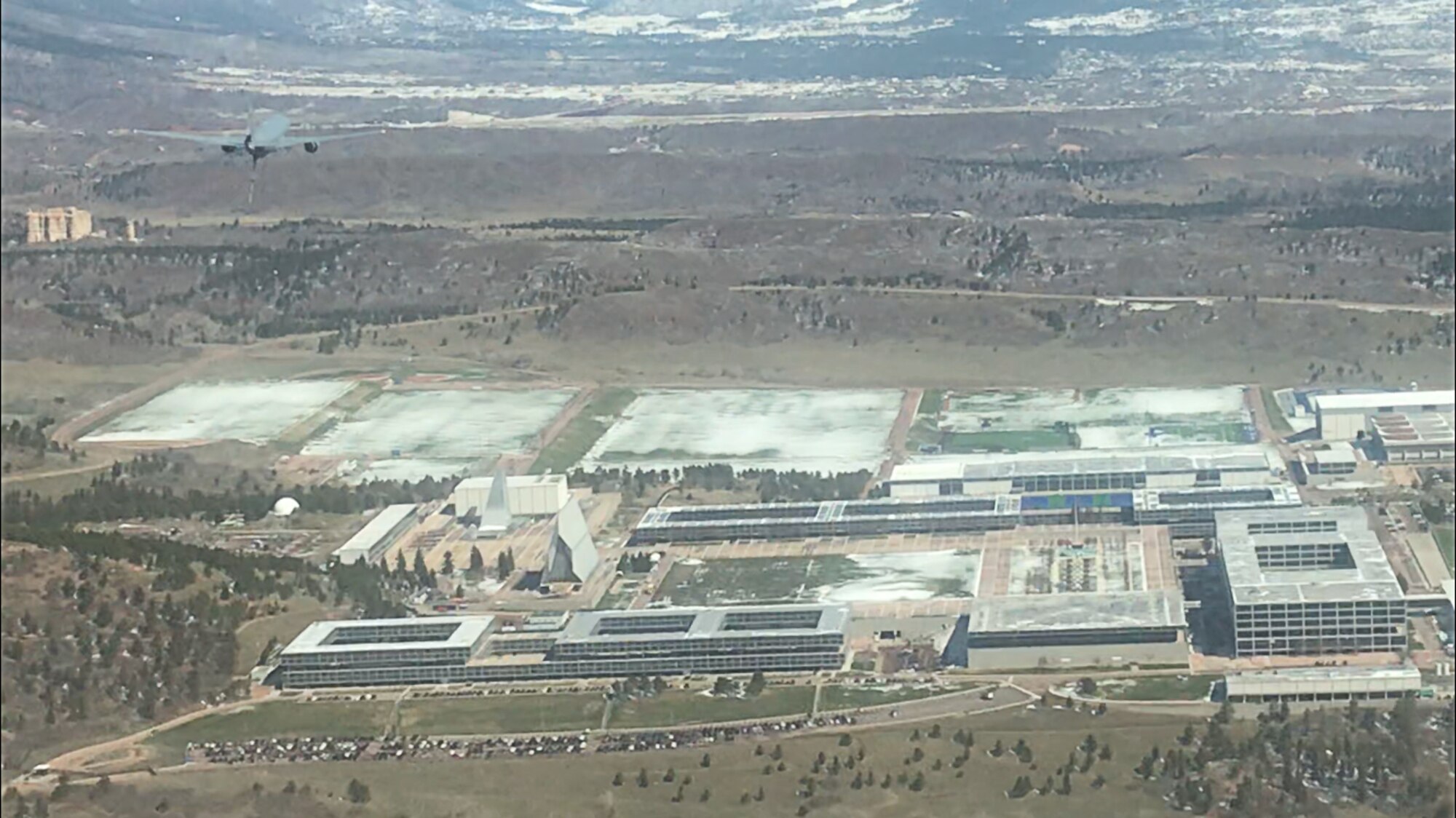 A KC-46 Pegasus, assigned to the 56th Air Refueling Squadron at Altus Air Force Base, Oklahoma, flies over the United States Air Force Academy in Colorado Springs, Colorado, April 17, 2020.