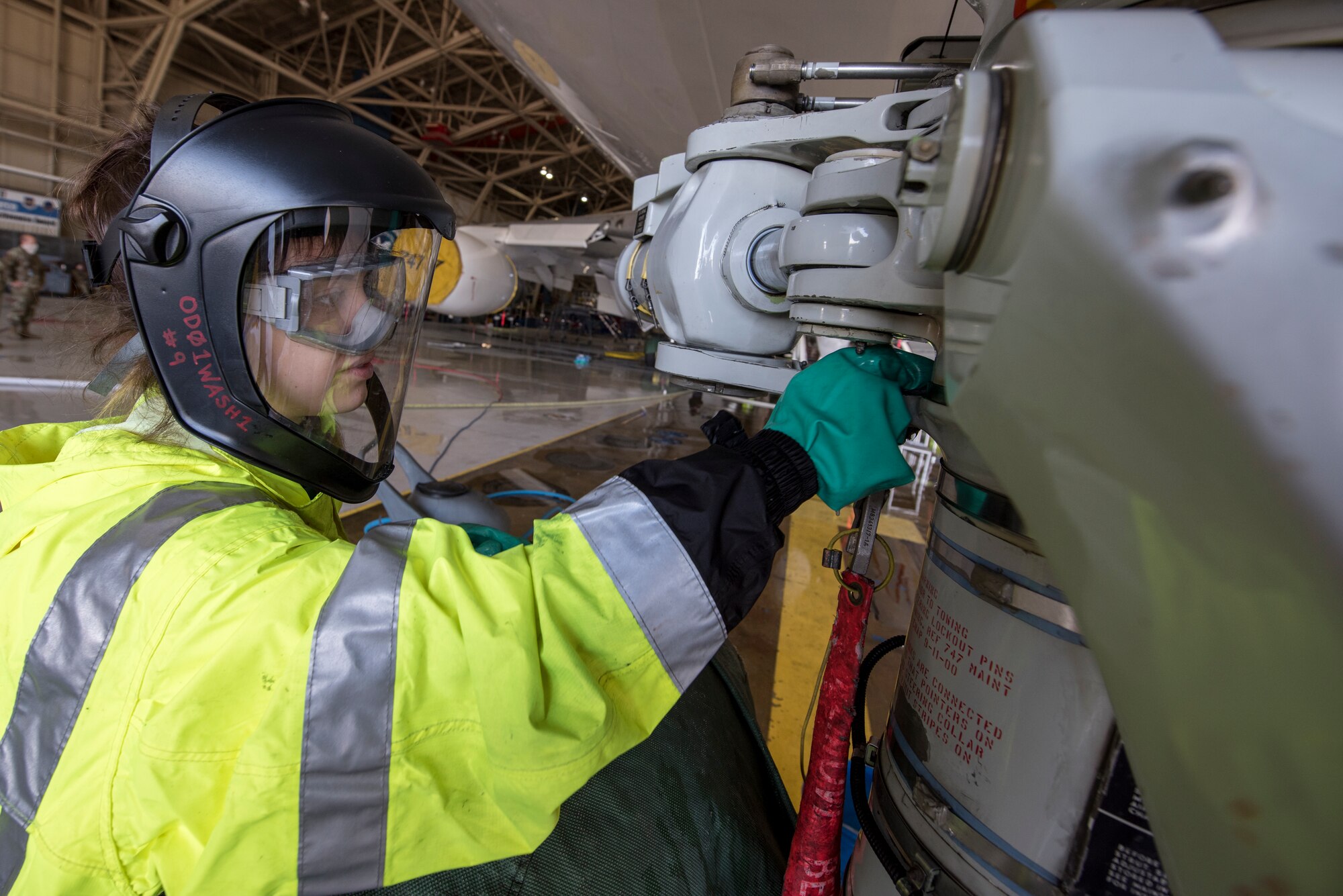 An airman cleans an E-4B at Offutt Air Force Base