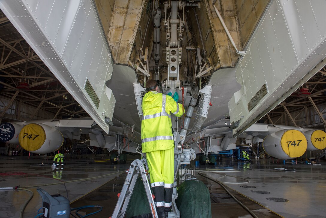 An airman cleans an E-4B at Offutt Air Force Base