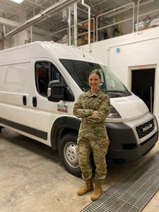 West Virginia Army National Guard 1st Lt. Samantha Fabian, commander of the 1201st Forward Support Company, poses in front of a mobile testing lab April 21, 2020. Fabian, the program director who leads the mobile laboratories, has been an instrumental part of establishing the DoD's first mobile testing labs for the National Guard. (courtesy photo)