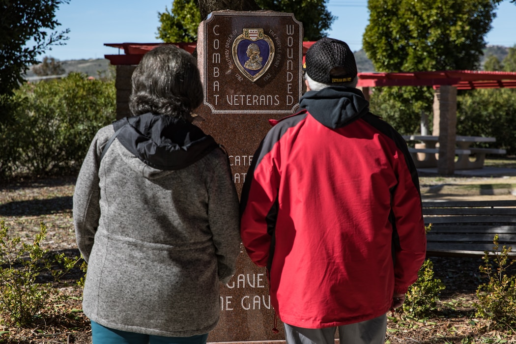 Retired U.S. Marine Corps Gunnery Sgt. Carlos Mariscal and his wife, both members of the 1st Marine Division Association, visit 5th Marine Regiment's Memorial Garden on Marine Corps Base Camp Pendleton, California, Jan. 30, 2020. The veterans visited the memorial to honor those Marines and Sailors who gave the ultimate sacrifice while serving with 1st Marine Division. (U.S. Marine Corps photo by Cpl. Alexa M. Hernandez)