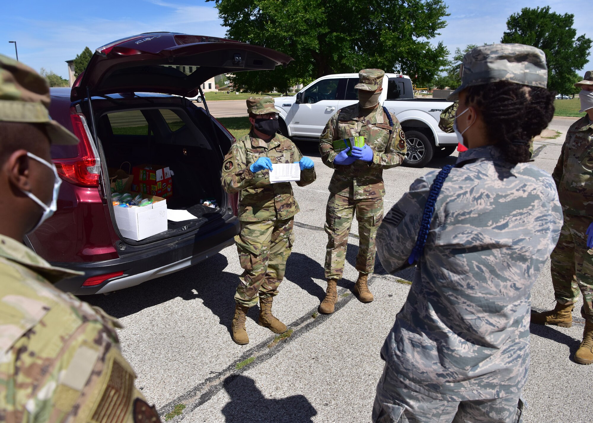 U.S. Air Force Tech. Sgt. Britteny Griffith, 17th Training Wing command chief executive assistant, briefs volunteers before delivering care packages to 17th TRW members in isolation on Goodfellow Air Force Base, Texas, April 20, 2020. Griffith is spearheading the base portion of the initiative, which is a joint project between the base and local civic leaders to ensure inbound members are taken care of during their mandatory isolation period as a result of the COVID-19 pandemic. (U.S. Air Force photo by Staff Sgt. Chad Warren)