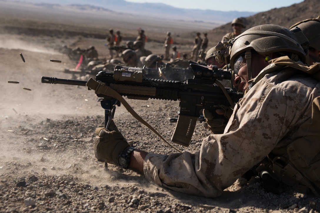 U.S. Marine Corps Lance Cpl. Darrion Green, a rifleman with 2nd Battalion, 5th Marine Regiment, 1st Marine Division, holds the defense during the Integrated Training Exercise (ITX) at Marine Air Ground Combat Center Twentynine Palms, California, Jan. 25, 2020. ITX is a month-long training event that applies combined-arms maneuver and offensive and defensive operations to prepare Marines for deployment. (U.S. Marine Corps photo by Cpl. Jack C. Howell)