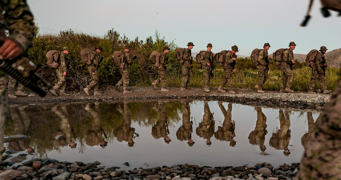 U.S. Marines with 2nd Battalion, 5th Marine Regiment, 1st Marine Division, hike during a Marine Corps Combat Readiness Evaluation (MCCRE) on Marine Corps Base Camp Pendleton, California, Sept. 18, 2019. 5th Marines conducted a regimental-sized MCCRE for 1st Battalion, 5th Marines and 2nd Battalion, 5th Marines, as well as the Regimental Headquarters to increase the combat proficiency and readiness of the regiment. The MCCRE took place over a 10 day period and served as proof of concept for future regimental-sized MCCREs. (U.S. Marine Corps photo by Lance Cpl. Roxanna Ortiz)