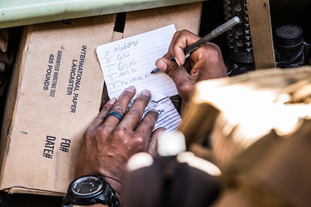 U.S. Navy HM2 Andrew Franco, a corpsman with 1st Battalion, 5th Marine Regiment, 1st Marine Division, writes down an evaluation of a simulated casualty evacuation during the Marine Corps Combat Readiness Evaluation (MCCRE) on Marine Corps Base Camp Pendleton, California, Sept. 18, 2019. 5th Marines conducted a regimental-sized MCCRE that included 1st Battalion, 5th Marines, 2nd Battalion, 5th Marines, and the Regimental Headquarters to increase the combat proficiency and readiness of the regiment. The MCCRE took place over a 10-day period and served as a proof of concept for future regimental-sized MCCREs. (U.S. Marine Corps photo by Lance Cpl. Alexa M. Hernandez)