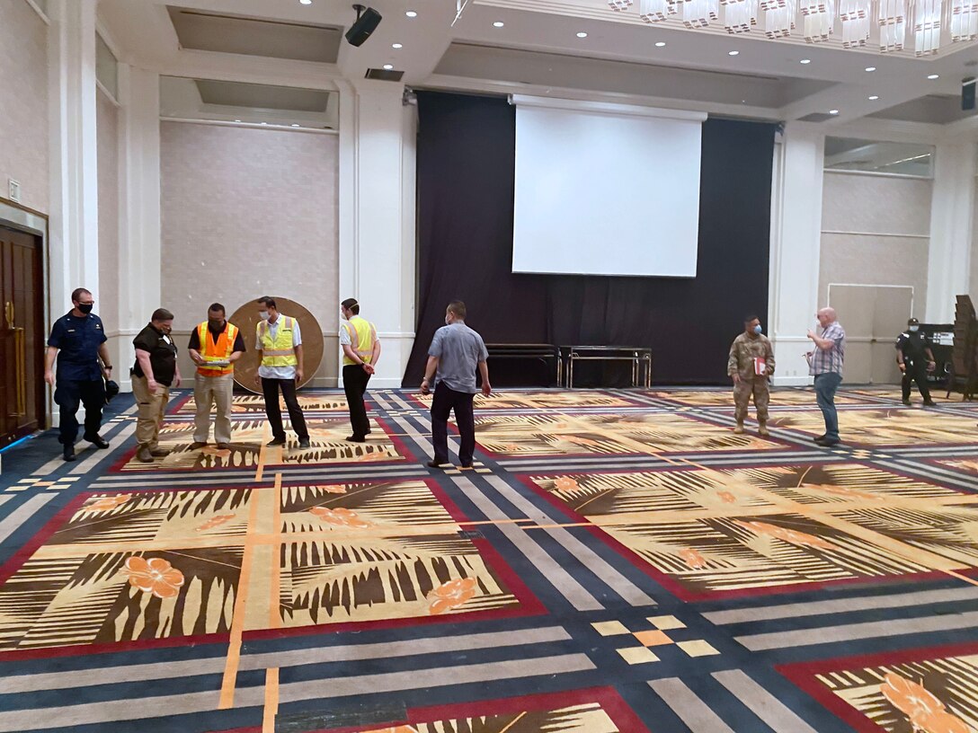Representatives from the U.S. Army Corps of Engineers (USACE), Honolulu District, the government of Guam, the Federal Emergency Management Agency (FEMA), NAVFAC Marianas, U.S. Department Health and Human Services, and 18th MEDCOM evaluate the ballroom inside the Sheraton Laguna Guam Resort Spa  in Tamuning for potential use as an Alternate Care Facility.