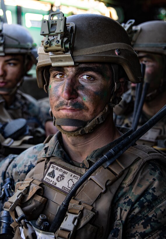 U.S. Marine Corps Cpl. Daniel Stolp, a squad leader with 2nd Battalion, 5th Marine Regiment, 1st Marine Division, rides in an assault amphibious vehicle during a Marine Corps Combat Readiness Evaluation (MCCRE) on Marine Corps Base Camp Pendleton, California, Sept. 23, 2019. 5th Marines conducted a regimental-sized MCCRE for 1st Battalion, 5th Marines and 2nd Battalion, 5th Marines, as well as the Regimental Headquarters to increase the combat proficiency and readiness of the regiment. The MCCRE took place over a 10 day period and served as proof of concept for future regimental-sized MCCREs. (U.S. Marine Corps photo by Lance Cpl. Roxanna Ortiz)