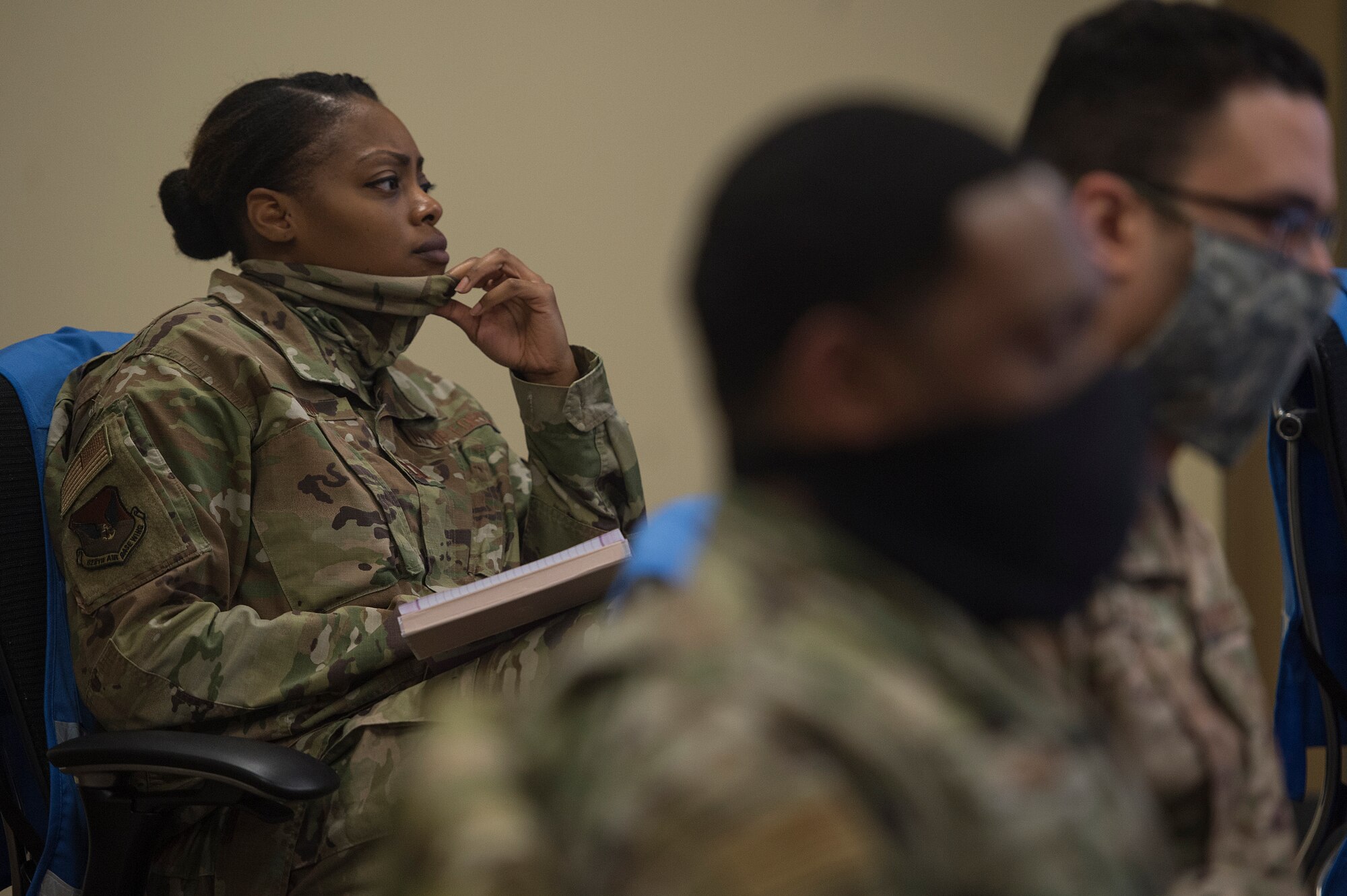 Capt. Felicia Logan, 628th Air Base Wing Office of the Staff Judge Advocate chief of operations law and COVID-19 Working Group member, takes notes during a meeting at the Emergency Operations Center located at Joint Base Charleston, S.C., April 16, 2020. Through the collaboration of ideas and perspectives, the group’s mission is to create possible solutions and generate recommendations for JB Charleston leaders. Their work allows commanders to make sound decisions affecting the installation and mission during the global pandemic.