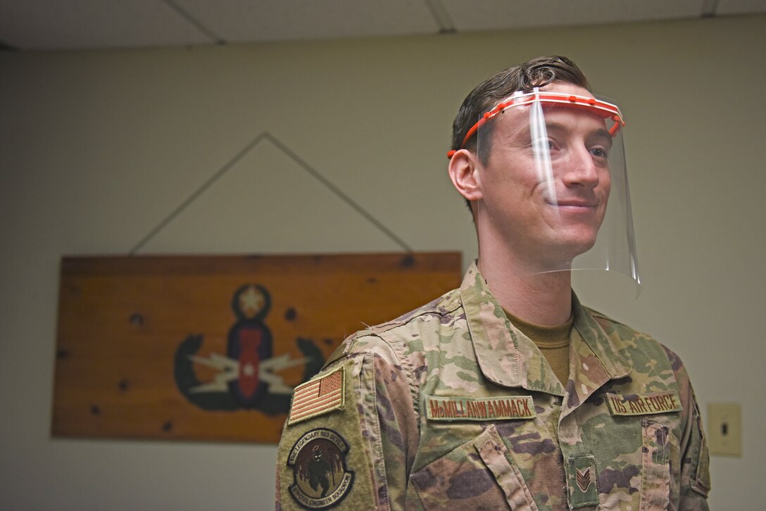 U.S. Air Force Staff Sgt. Tyler McMillan Wammack, 8th Civil Engineer Squadron explosive ordnance disposal journeyman, dons the first prototype of the protective plastic face shield at Kunsan Air Base, Republic of Korea, April 20, 2020. EOD created two initial face shield designs, working closely with the 8th Medical Group to ensure the design both protects Airmen and prevents the spread of the disease. (U.S. Air Force photo by Staff Sgt. Mackenzie Mendez)