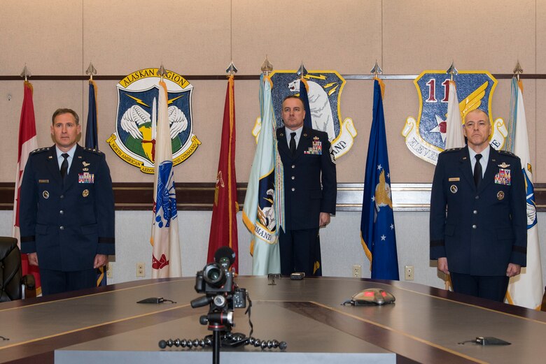 U.S. Air Force Lt. Gen. David A. Krumm takes command of Alaskan North American Aerospace Defense Command, Alaskan Command, and the Eleventh Air Force from outgoing commander, Lt. Gen. Thomas Bussiere, during a change of command ceremony April 20, 2020 at Joint Base Elmendorf-Richardson, Alaska. Due to physical restrictions of the ongoing COVID-19 pandemic, the virtual change of command ceremony was presided over via video teleconference by Air Force Gen. Terrence O’Shaughnessy, commander of the North American Aerospace Defense Command and United States Northern Command, and Air Force Gen. Charles Q. Brown, Pacific Air Forces commander.
