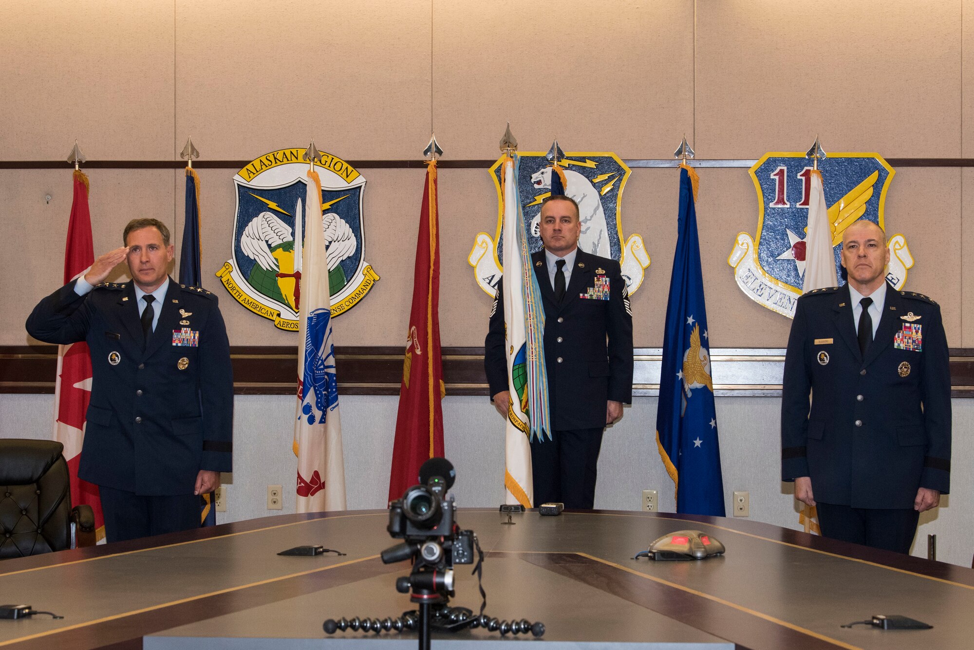 U.S. Air Force Lt. Gen. David A. Krumm takes command of Alaskan North American Aerospace Defense Command, Alaskan Command, and the Eleventh Air Force from outgoing commander, Lt. Gen. Thomas Bussiere, during a change of command ceremony April 20, 2020 at Joint Base Elmendorf-Richardson, Alaska. Due to physical restrictions of the ongoing COVID-19 pandemic, the virtual change of command ceremony was presided over via video teleconference by Air Force Gen. Terrence O’Shaughnessy, commander of the North American Aerospace Defense Command and United States Northern Command, and Air Force Gen. Charles Q. Brown, Pacific Air Forces commander.