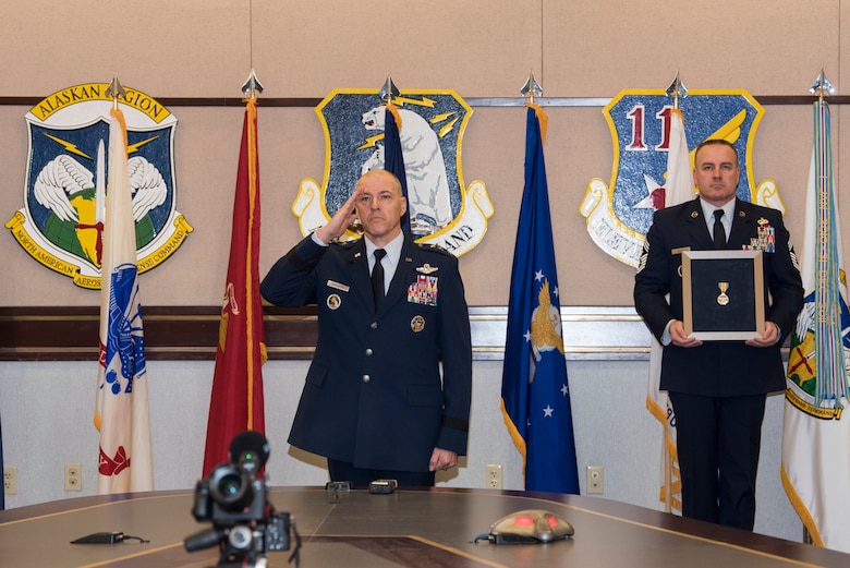 U.S. Air Force Lt. Gen. Thomas A. Bussiere is awarded the Defense Distinguished Service Medal during a change of command ceremony April 20, 2020, at Joint Base Elmendorf-Richardson, Alaska. The Defense Distinguished Service Medal is presented to members for exceptionally distinguished performance of duty contributing to the national security or defense of the United States. Due to physical restrictions of the ongoing COVID-19 pandemic, the virtual change of command ceremony was presided over via video teleconference by Air Force Gen. Terrence O’Shaughnessy, commander of the North American Aerospace Defense Command and United States Northern Command, and Air Force Gen. Charles Q. Brown, Pacific Air Forces commander.