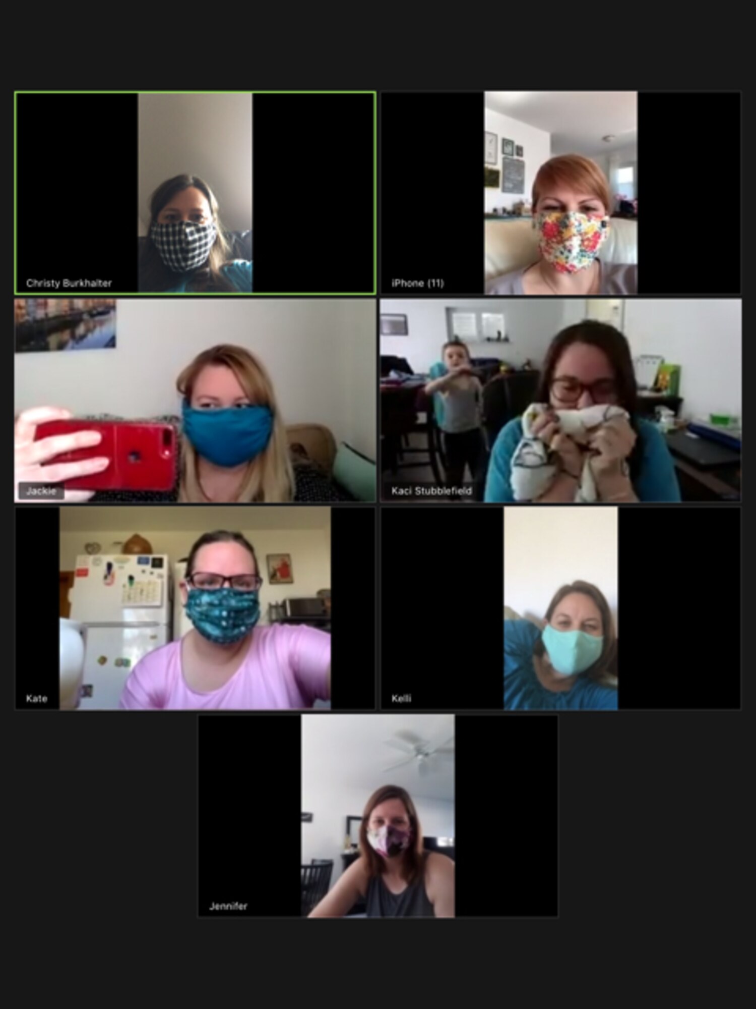 435th Contingency Response Support Squadron spouses show off their cloth face coverings during a group video chat.