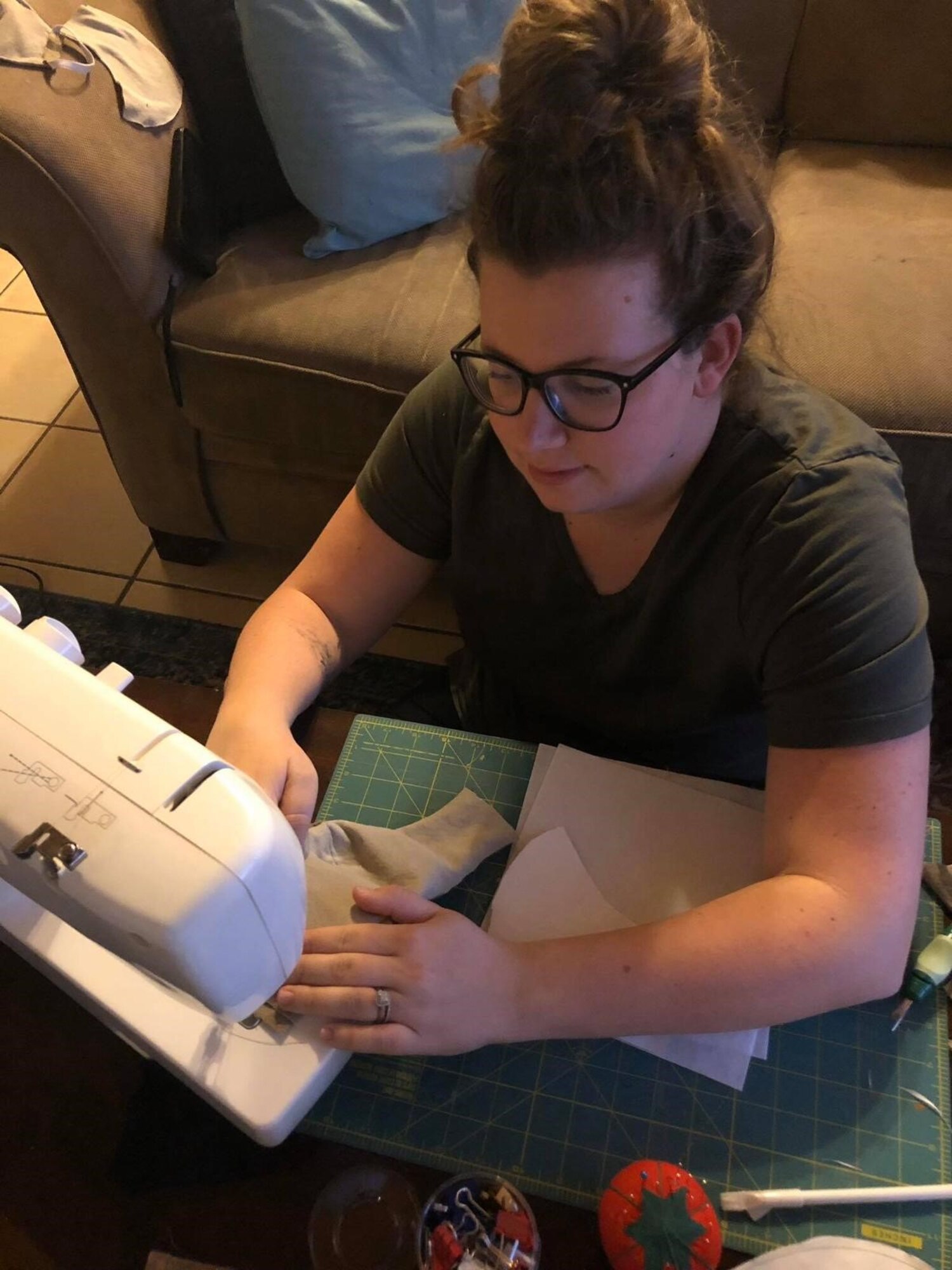 Brittany Baca, 435th Security Forces Squadron key spouse, makes cloth face coverings for Airmen and their families at her home, in early April 2020.