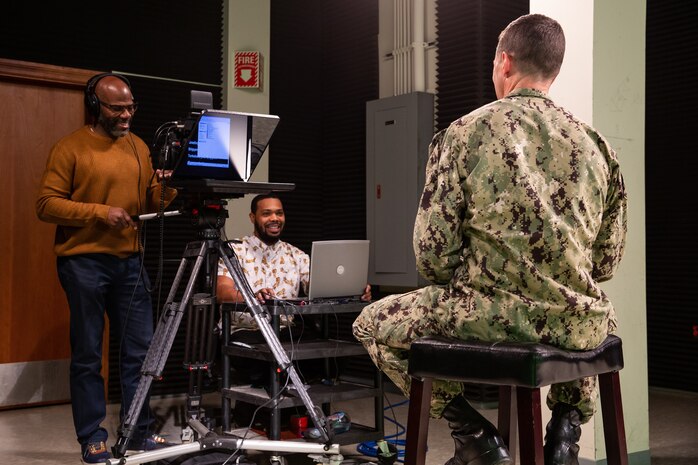 Code 1170 Videographers Greg Boyd and Alim Jordan run the teleprompter and film NNSY Commander Capt. Kai Torkelson as he provides his latest COVID-19 Update to the workforce.