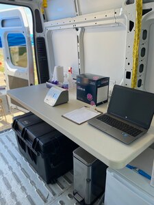 Photo depicting a mobile coronavirus testing unit inside a van. The West Virginia National Guard recently became the first National Guard unit approved by the Department of Defense to operate a COVID-19 mobile testing lab. Two labs became operational April 17, 2020.