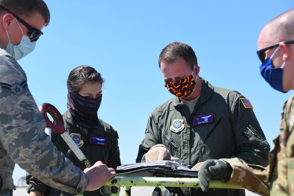 Maj. Seth Paulsen, 349th Air Refueling Squadron chief of standards and evaluations, reviews the mission and egress plan prior to a preflight check Apr. 8, 2020, at McConnell Air Force Base, Kansas. Approximately half of the 349th squadron deployed to Al Udeid Air Base, Qatar, supporting air refueling operations to U.S. and allied partners. (U.S. Air Force photo by Airman 1st Class Nilsa E. Garcia)