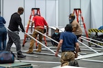 Men and women work on constructing medical stations in New York City.