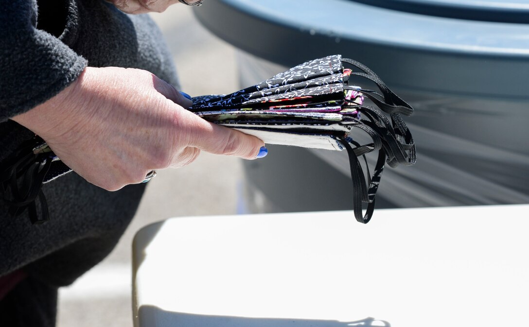 U.S. Air Force Chief Master Sgt. Jeannette Roman, 655th Intelligence, Surveillance and Reconnaissance Wing command chief liaison, holds a stack of masks she is donating at the 88th Air Base Wing’s donation drop off point outside the chapel located in the Prairies housing area at Wright-Patterson Air Force Base, Ohio, April 21, 2020. (U.S. Air Force photo/Wesley Farnsworth)