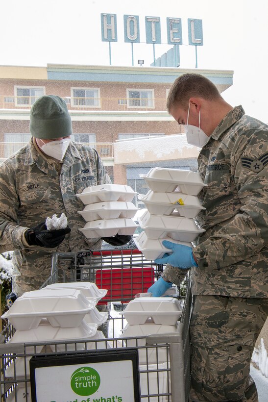 Colorado Air National Guard aircraft structural maintenance mechanic, deliver meals to guests at a hotel in Denver