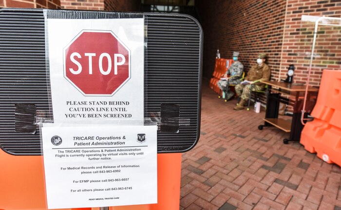 Airmen with the 628th Medical Group sit outside waiting for patients at Joint Base Charleston S.C., April 15, 2020.