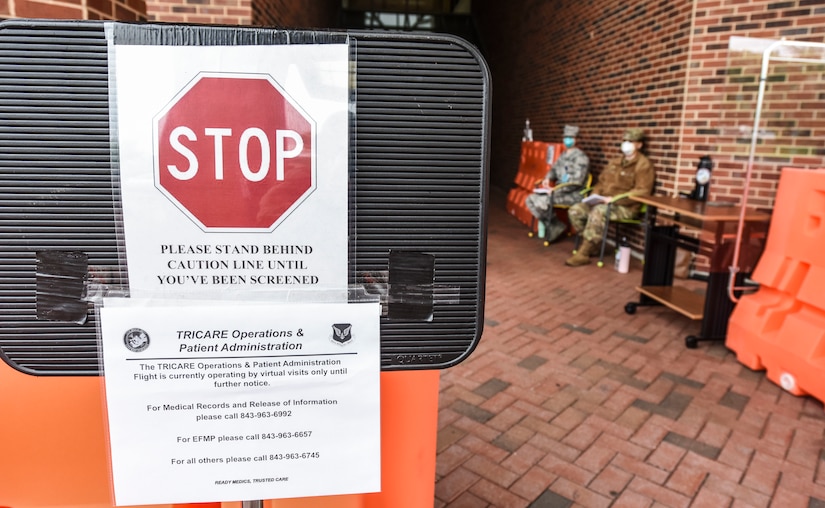 Airmen with the 628th Medical Group sit outside waiting for patients at Joint Base Charleston S.C., April 15, 2020.