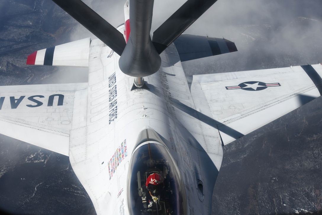 An F-16 Fighting Falcon Thunderbird receives fuel from a KC-135 Stratotanker, assigned to the 349th Air Refueling Squadron at McConnell Air Force Base, Kansas, April 18, 2020, in the skies of Colorado. Aerial refueling support was provided by KC-135 Stratotankers from Team McConnell and March Air Reserve Base, Colorado. Six F-16’s were refueled three separate times during the flight towards Denver. (U.S. Air Force photo by Airman 1st Class Nilsa E. Garcia)