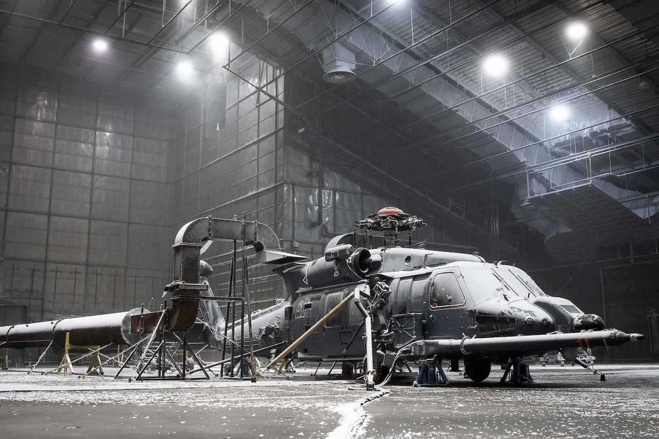 Helicopter sits in a frozen chamber for testing.