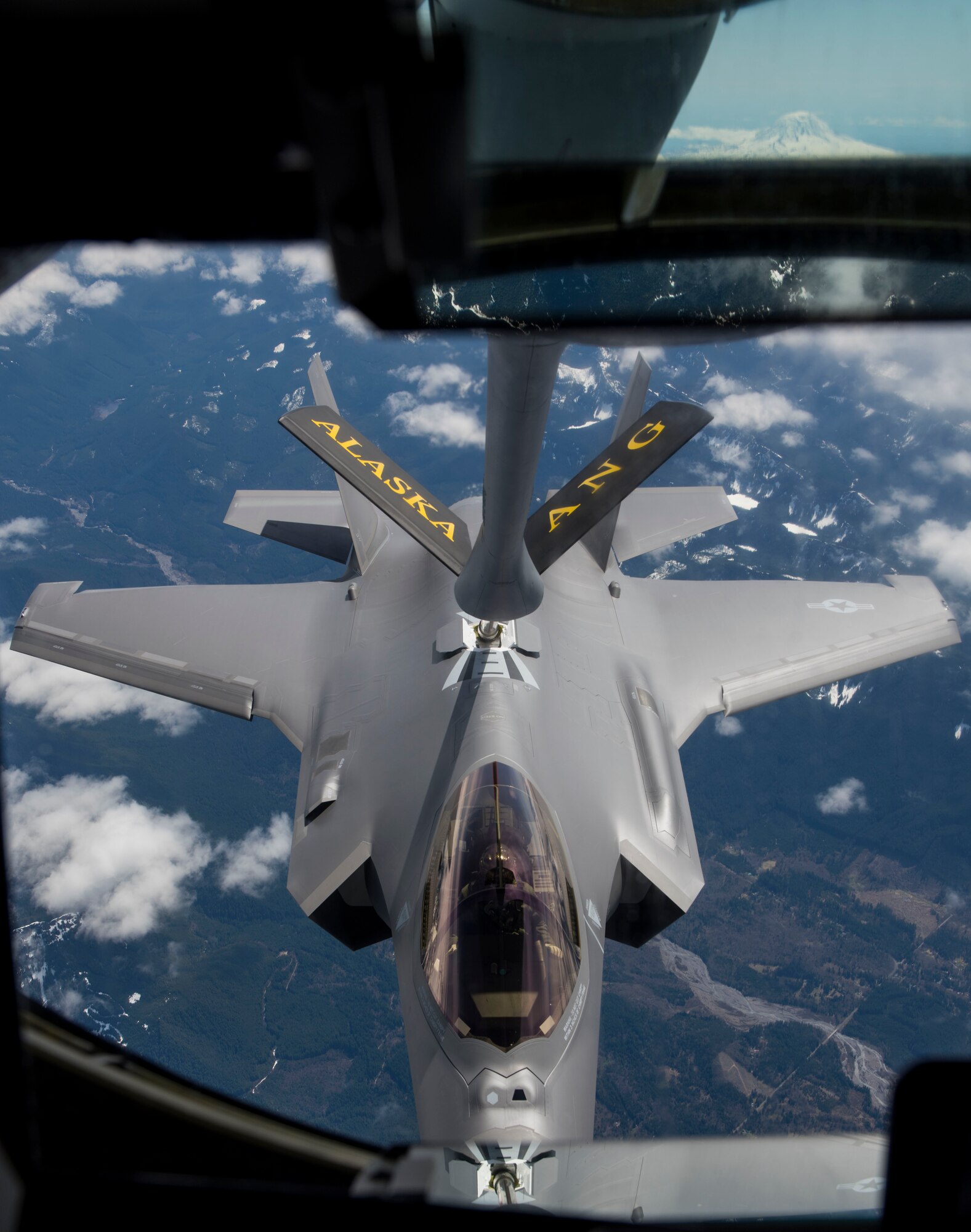 A new F-35A Lightning II refuels mid-air by a 168th Wing, Alaska Air National Guard, KC-135R Stratrotanker, enroute from the Lockheed Martin factory in Fort Worth, Texas, to the 354th Fighter Wing, Eielson Air Force Base, Alaska, April 21, 2020.