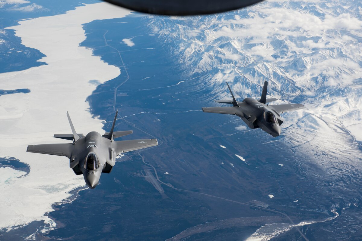 Two F-35A Lightning II aircraft fly over the Alaska Canada Highway en route to their new home at the 354th Fighter Wing, Eielson Air Force Base, Alaska, April 21, 2020.