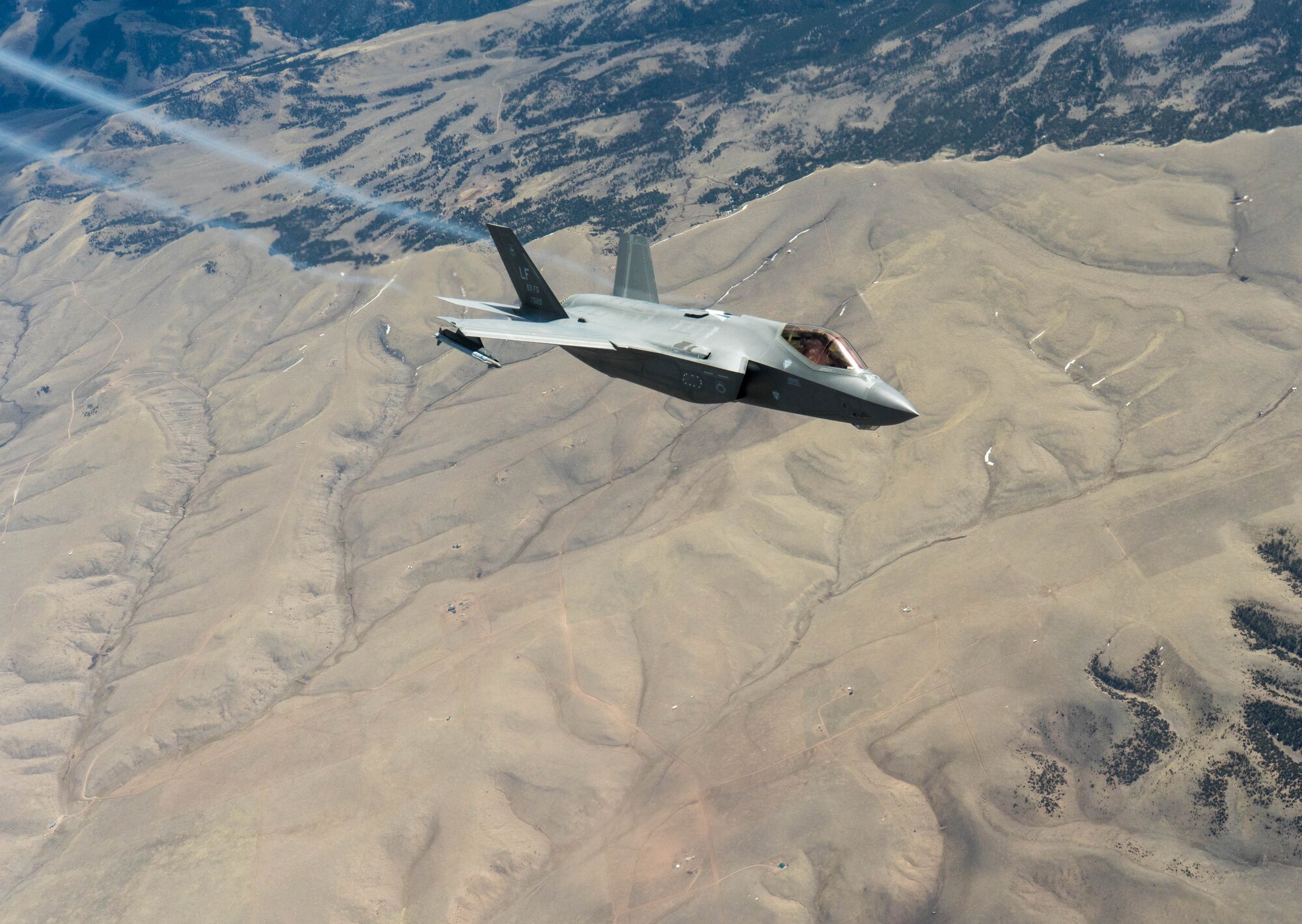 An F-35A Lightning II assigned to the 63rd Fighter Squadron at Luke Air Force Base, Ariz., banks away after receiving fuel from a KC-135 Stratotanker, assigned to the Arizona Air National Guard, 161st Air Fueling Wing April 17, 2020, over Colorado.