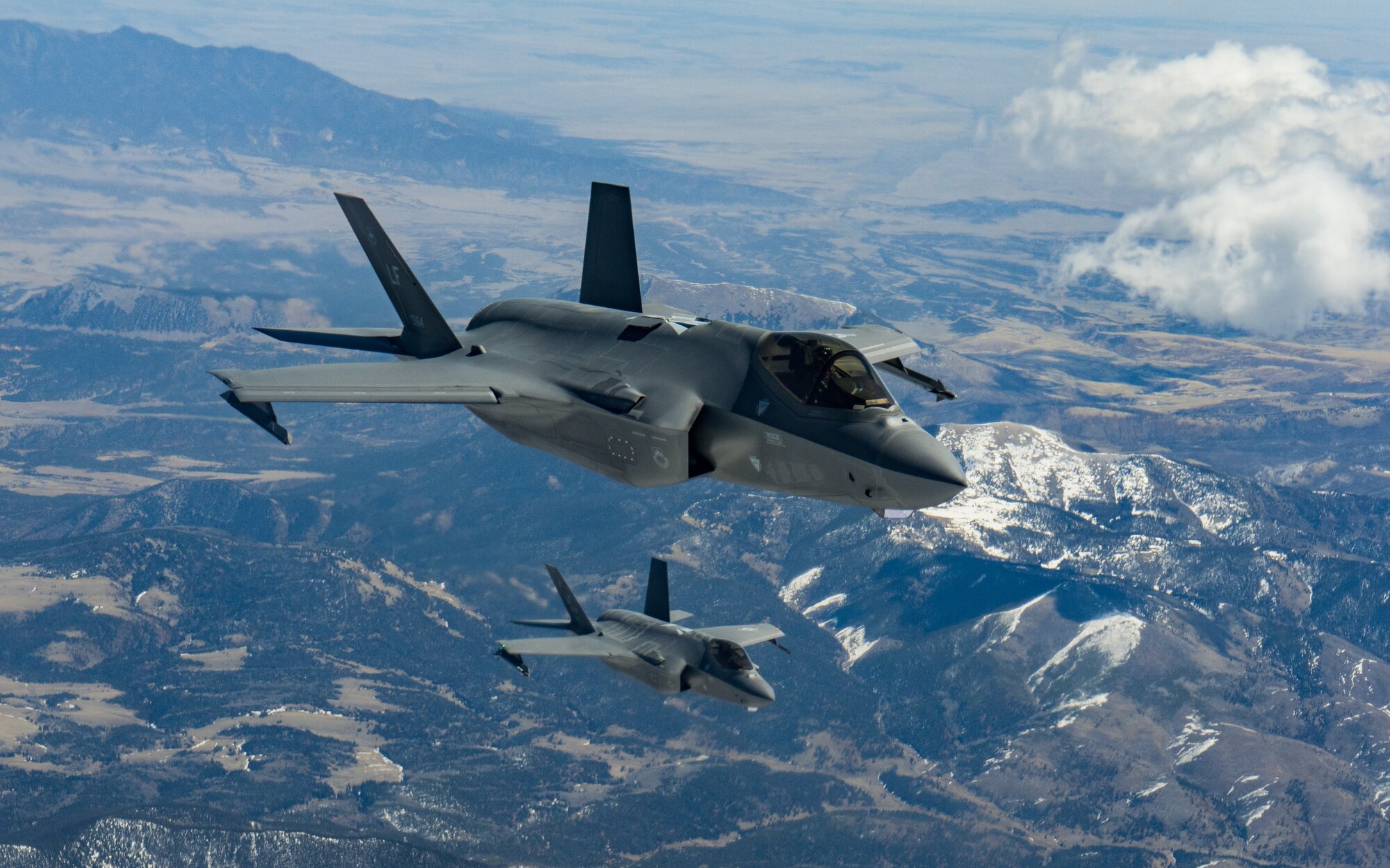 Two F-35A Lightning IIs assigned to the 56th Fighter Wing at Luke Air Force Base, Ariz., fly over Colorado during a refueling mission April 17, 2020.