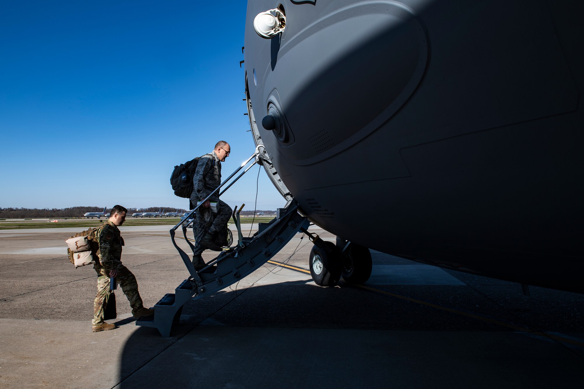 Lt. Col. David Severs, 911th Aeromedical Staging Squadron clinical nurse and Lt. Col. Charles Giordano, 911th ASTS certified registered nurse anesthetist, board a C-17 Globemaster III before departing Pittsburgh International Airport Air Reserve Station, Pennsylvania, April 22, 2020.