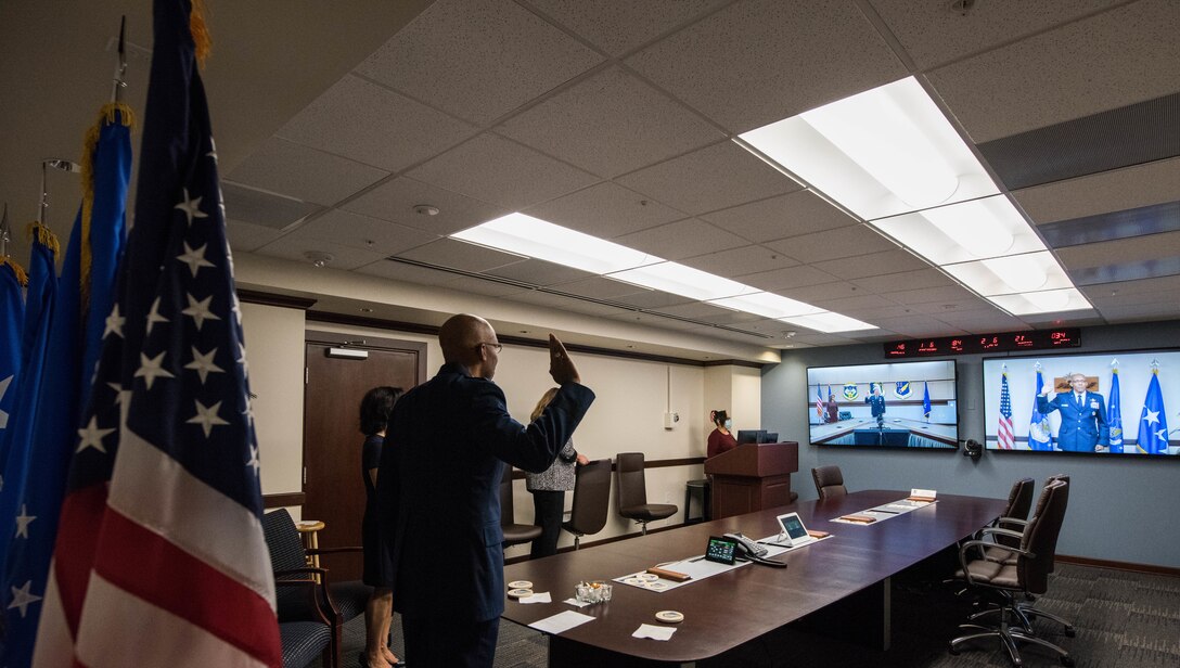 Gen. CQ Brown, Jr., Pacific Air Forces commander, administers the oath of office to Lt. Gen. David A. Krumm during a virtual promotion ceremony, on Joint Base Pearl Harbor-Hickam, Hawaii and Joint Base Elmendorf-Richardson, Alaska, April 20, 2020. Due to COVID-19, Brown presided over the promotion ceremony via virtual teleconference. Once the promotion ceremony was complete, Krumm assumed command of Alaskan Command, United States Northern Command; Eleventh Air Force, PACAF; and North American Aerospace Defense Command, JBER. (U.S. Air Force photo by Staff Sgt. Hailey Haux)