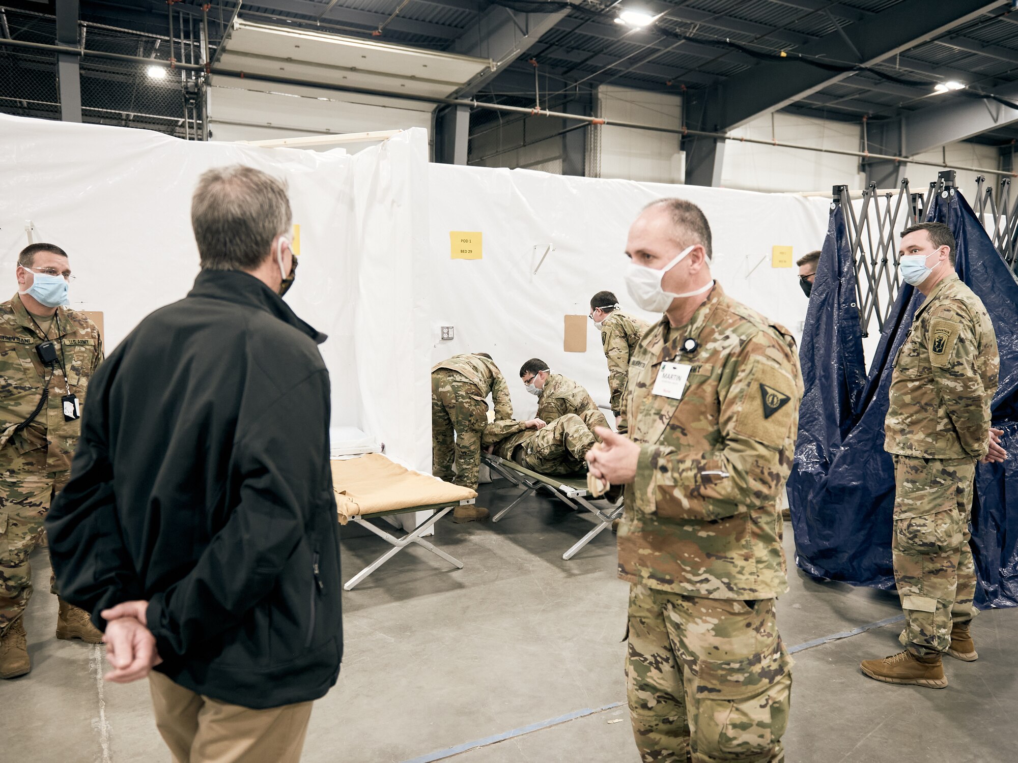 Vermont Governor Phil Scott is observes training taking place at a medical facility at the Champlain Valley Exposition.