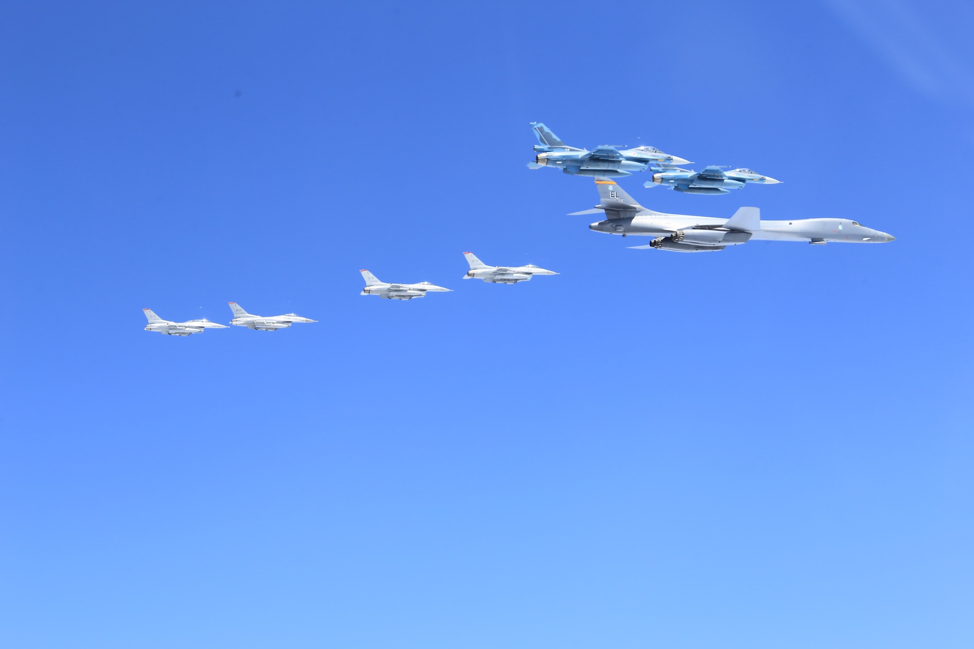 A U.S. Air Force B-1B Lancer from Ellsworth Air Force Base, S.D. and F-16 Fighting Falcons from Misawa Air Base, Japan, conducted bilateral joint training with Japan Air Self-Defense Force (JASDF) F-2s and F-15s off the coast of Northern Japan, April 22, 2020. U.S. Strategic Command's bomber forces regularly conduct combined theater security cooperation engagements with allies and partners, demonstrating U.S. capability to command, control and conduct bomber missions around the world. (Courtesy photo by the Japan Air-Self Defense Force)