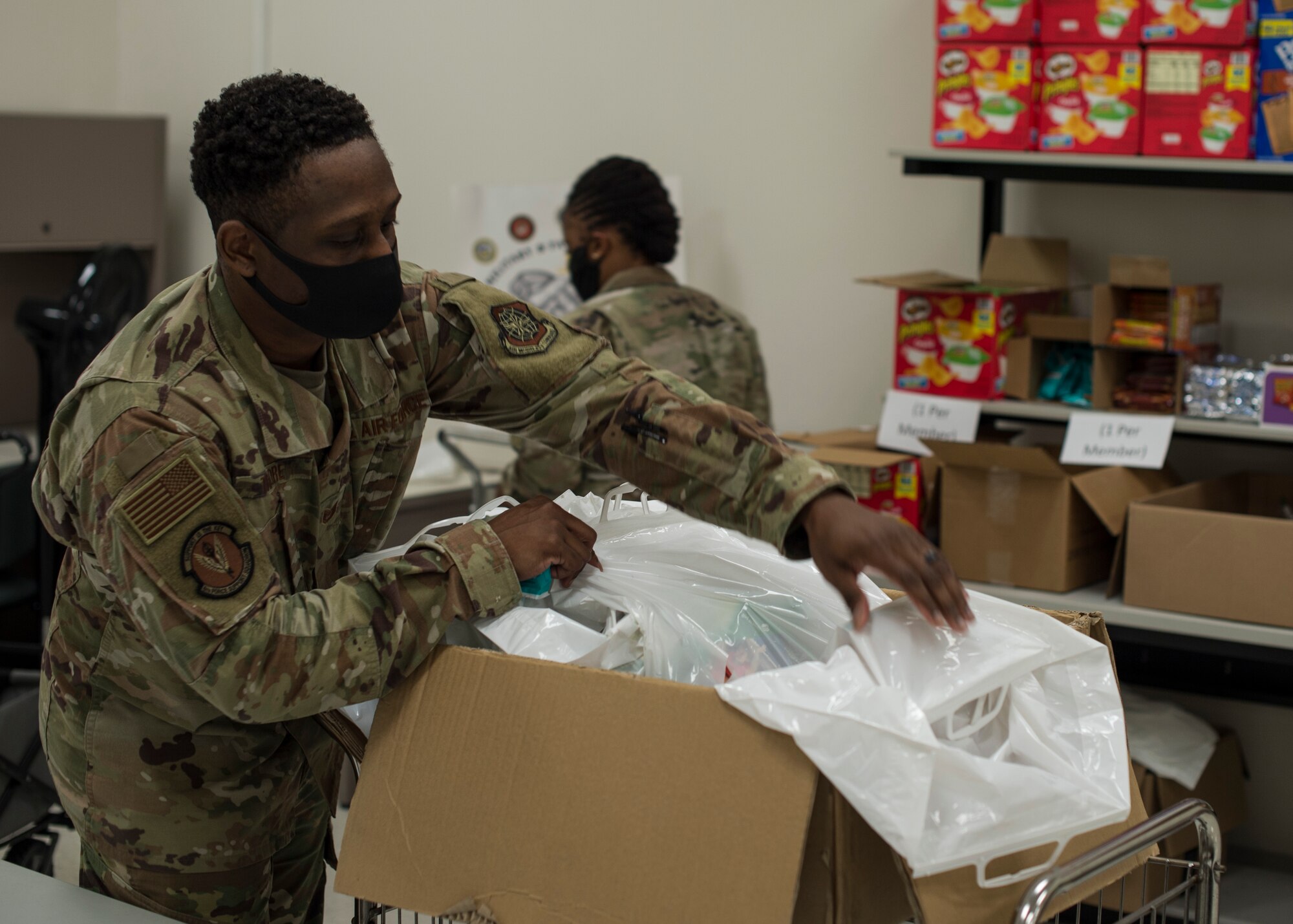 U.S. Air Force Staff Sgt. Tristan Traore, a 6th Force Support Squadron readiness NCO, sorts through care packages at the Military and Family Readiness Center (MFRC) at MacDill Air Force Base, Fla., April 17, 2020.