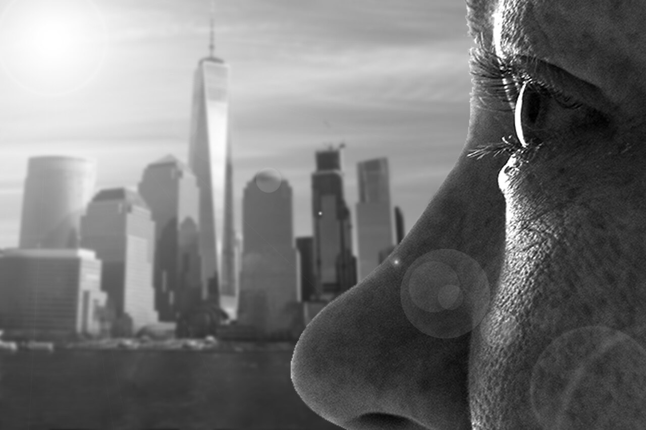 Profile of a woman with a cityscape in the background.