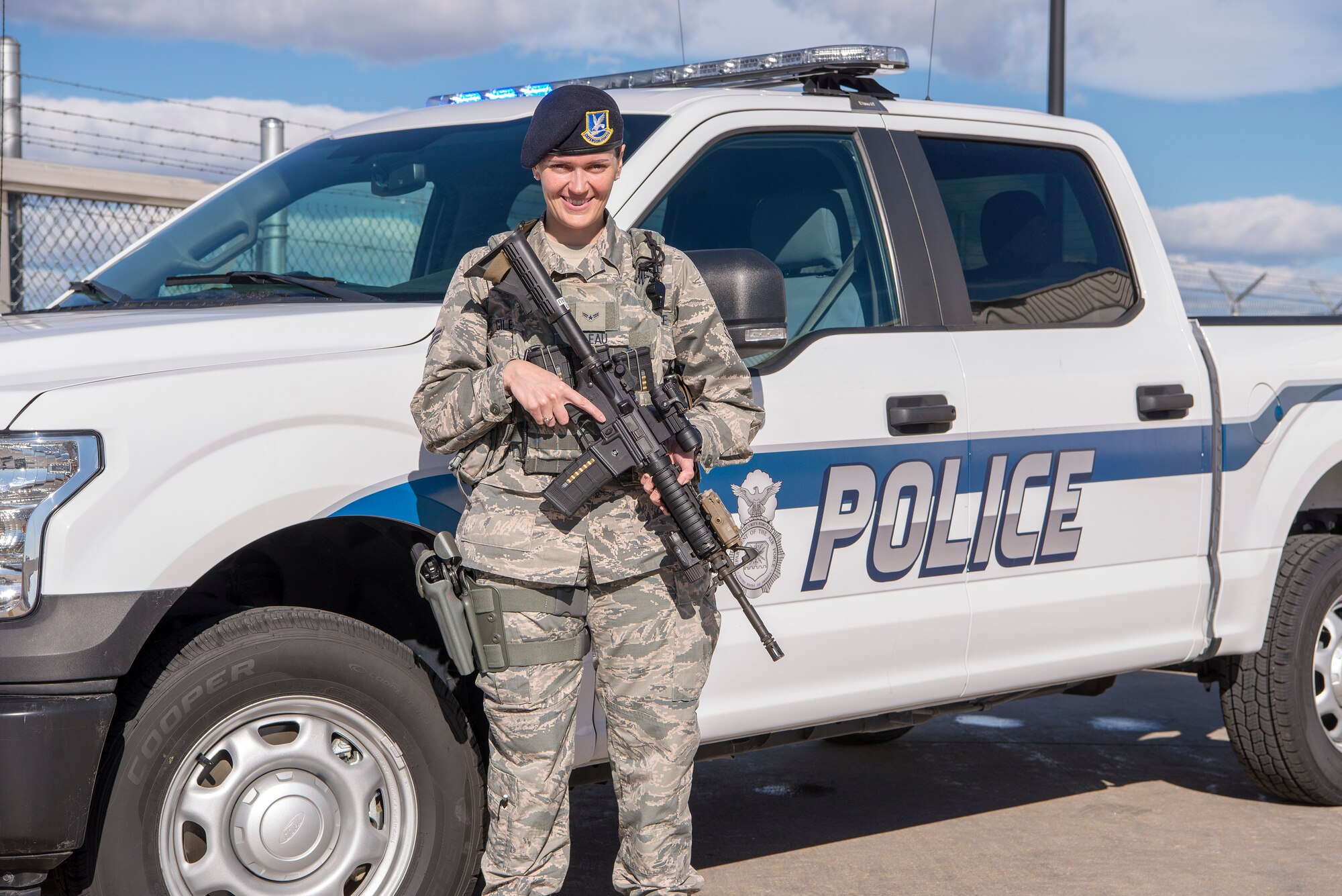 Security Forces Airman in front of truck