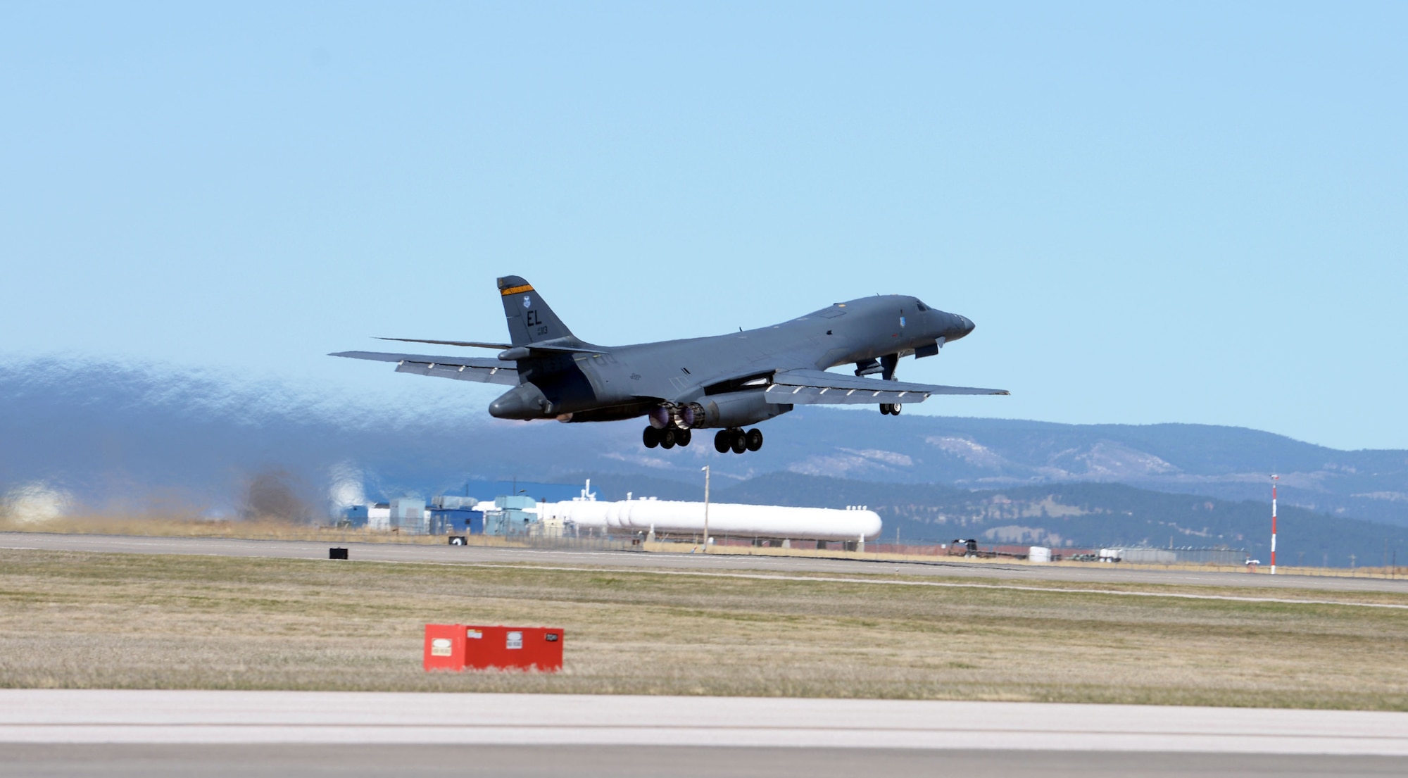 A U.S. Air Force B-1B Lancer thunders down the runway at Ellsworth Air Force Base, S.D., April 21, 2020. The B-1 bomber flew from the continental United States and integrated with the Koku Jieitai (Japan Air Self Defense Force or JASDF) to conduct bilateral and theater familiarization training near Japan. (U.S. Air Force photo by Airman Quentin K. Marx)