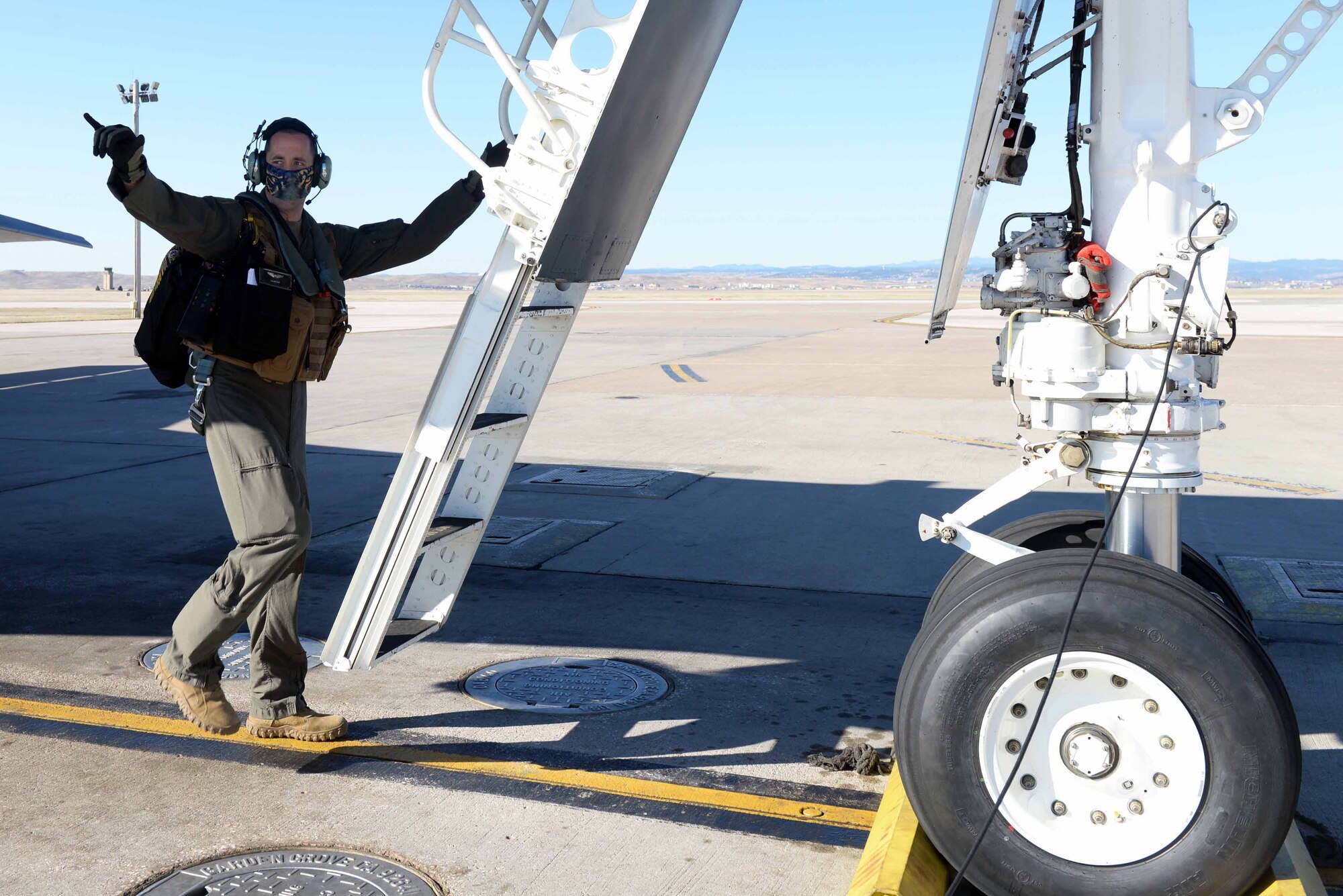 U.S. Air Force Capt. Lance Huston, a 37th Bomb Squadron weapons systems officer, prepares to board a B-1B Lancer at Ellsworth Air Force Base, S.D., April 21, 2020. Aircrew from the 37th BS flew a B-1B Lancer from the continental United States and integrated with the Koku Jieitai (Japan Air Self Defense Force or JASDF) to conduct bilateral and theater familiarization training near Japan. (U.S. Air Force photo by Airman Quentin K. Marx)