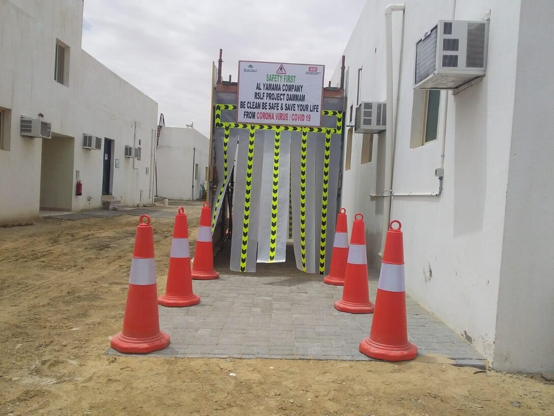 Protecting workers through disinfection tunnel at Artillery Project, Al-Yamama Company, Dammam, in the Kingdom of Saudi Arabia.