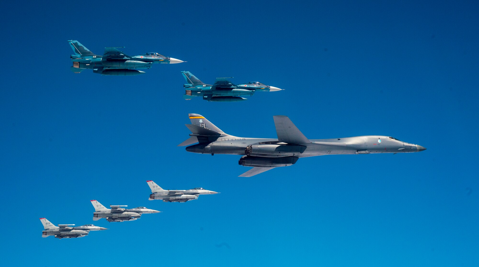 A U.S. Air Force B-1B Lancer from Ellsworth Air Force Base, S.D. and F-16 Fighting Falcons from Misawa Air Base, Japan, conducted bilateral joint training with Japan Air Self-Defense Force (JASDF) F-2s off the coast of Northern Japan, April 22, 2020. U.S. Strategic Command's bomber forces regularly conduct combined theater security cooperation engagements with allies and partners, demonstrating U.S. capability to command, control and conduct bomber missions around the world. (U.S. Air Force photo by Tech. Sgt. Timothy Moore)