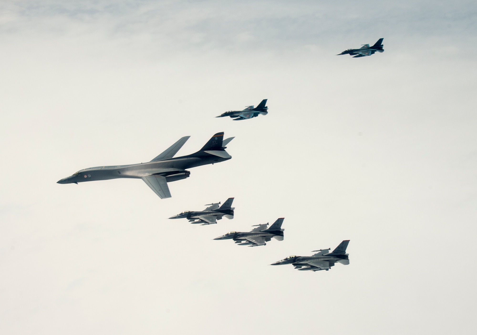 A U.S. Air Force B-1B Lancer from Ellsworth Air Force Base, S.D. and F-16 Fighting Falcons from Misawa Air Base, Japan, conducted bilateral joint training with Japan Air Self-Defense Force (JASDF) F-2s off the coast of Northern Japan, April 22, 2020. U.S. Strategic Command's bomber forces regularly conduct combined theater security cooperation engagements with allies and partners, demonstrating U.S. capability to command, control and conduct bomber missions around the world. (U.S. Air Force photo by Tech. Sgt. Timothy Moore)