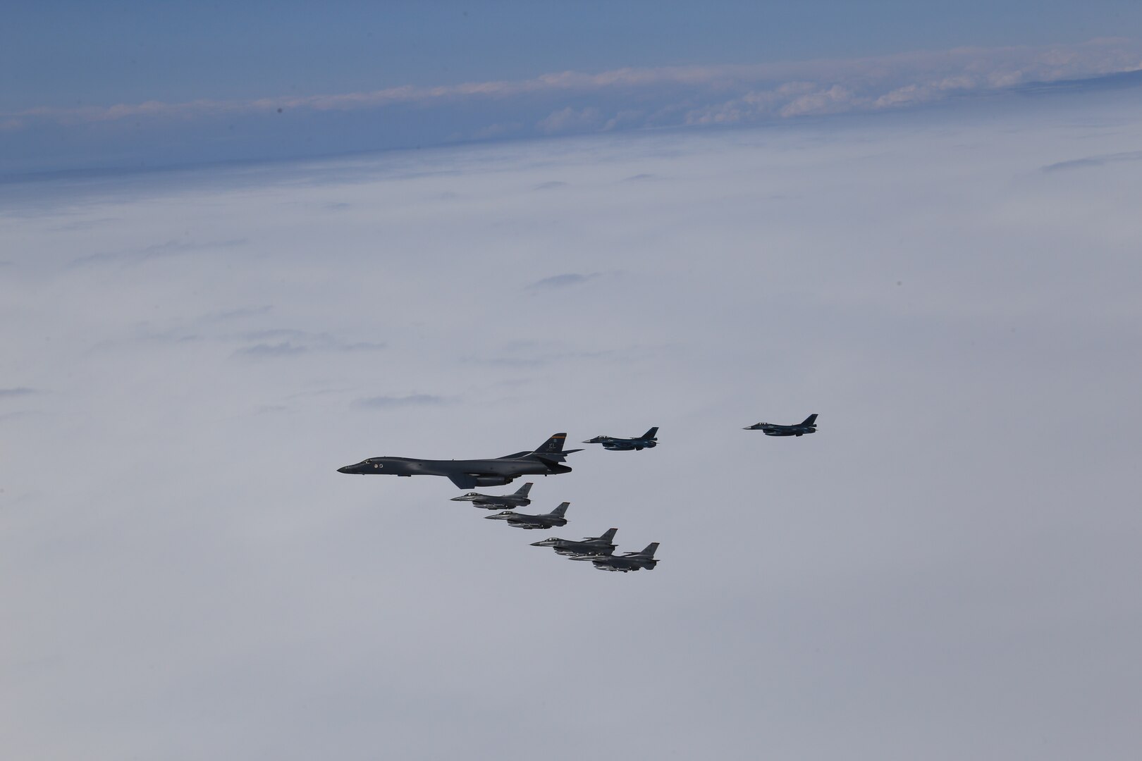 A U.S. Air Force B-1B Lancer from Ellsworth Air Force Base, S.D. and F-16 Fighting Falcons from Misawa Air Base, Japan, conducted bilateral joint training with Japan Air Self-Defense Force (JASDF) F-2s and F-15s off the coast of Northern Japan, April 22, 2020. U.S. Strategic Command's bomber forces regularly conduct combined theater security cooperation engagements with allies and partners, demonstrating U.S. capability to command, control and conduct bomber missions around the world. (Courtesy photo by the Japan Air-Self Defense Force)